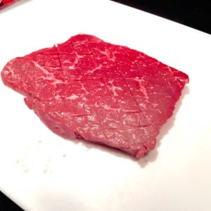 Steak scored with a knife in order to make Chaliapin Steak