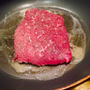 A cooking shot of Chaliapin Steak, similar to what is seen in Shokugeki no Soma