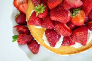 A close-up photo of the Victoria Sponge Cake with Balsamic Strawberries.