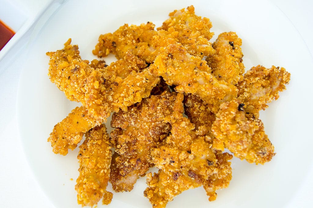 Captain Crunch Chicken Strips with Maple Sriracha Dipping Sauce, Captain Crunch Chicken Strips, Maple Sriracha Sauce, Dipping Sauce, Chicken nuggets, chicken strips, cap'n crunch, cap'n crunch chicken recipe, captain crunch chicken recipe, planet hollywood captain crunch chicken, chicken tenders, easy chicken nuggets, cereal chicken strips, cereal chicken nuggets, cereal chicken, maple sriracha, chocolates and chai, chocolates & chai