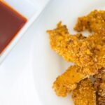 Captain Crunch Chicken Strips with Maple Sriracha Dipping Sauce, Captain Crunch Chicken Strips, Maple Sriracha Sauce, Dipping Sauce, Chicken nuggets, chicken strips, cap'n crunch, cap'n crunch chicken recipe, captain crunch chicken recipe, planet hollywood captain crunch chicken, chicken tenders, easy chicken nuggets, cereal chicken strips, cereal chicken nuggets, cereal chicken, maple sriracha, chocolates and chai, chocolates & chai