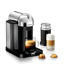 Nespresso Virtuoline with Aeroccino Milk Frother and a latte next to it.