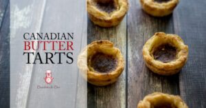 A horizontal image of perfect Canadian butter tarts lined up vertically with an overlay showing the post title.