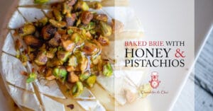 A close-up photo of baked brie with honey; post title and logo on the right hand side.