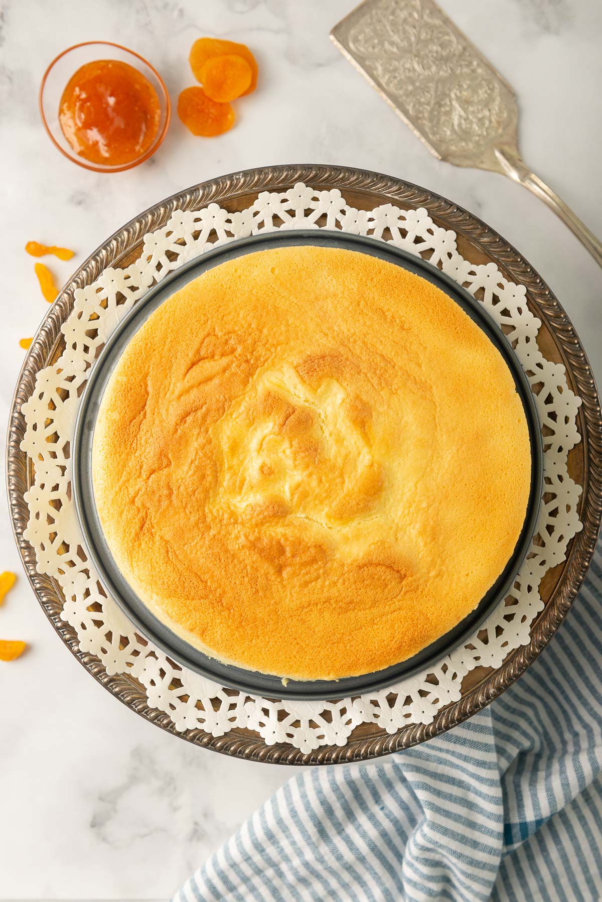 An overhead photo looking down on a full Japanese Cotton Cheesecake, without any added decoration or glaze.