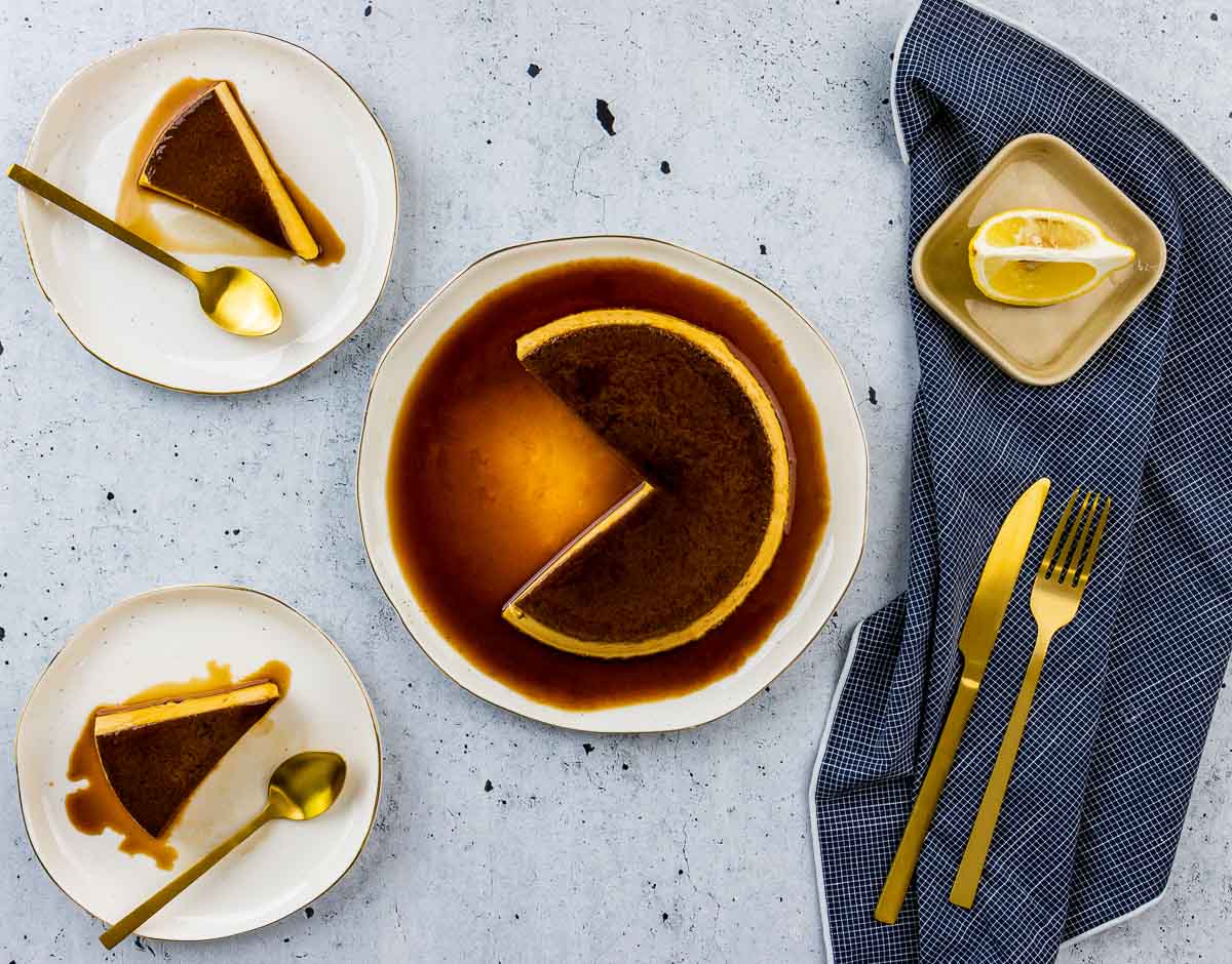 Brown Sugar Creme Caramel with two slices cut from it, placed on two separate dishes.