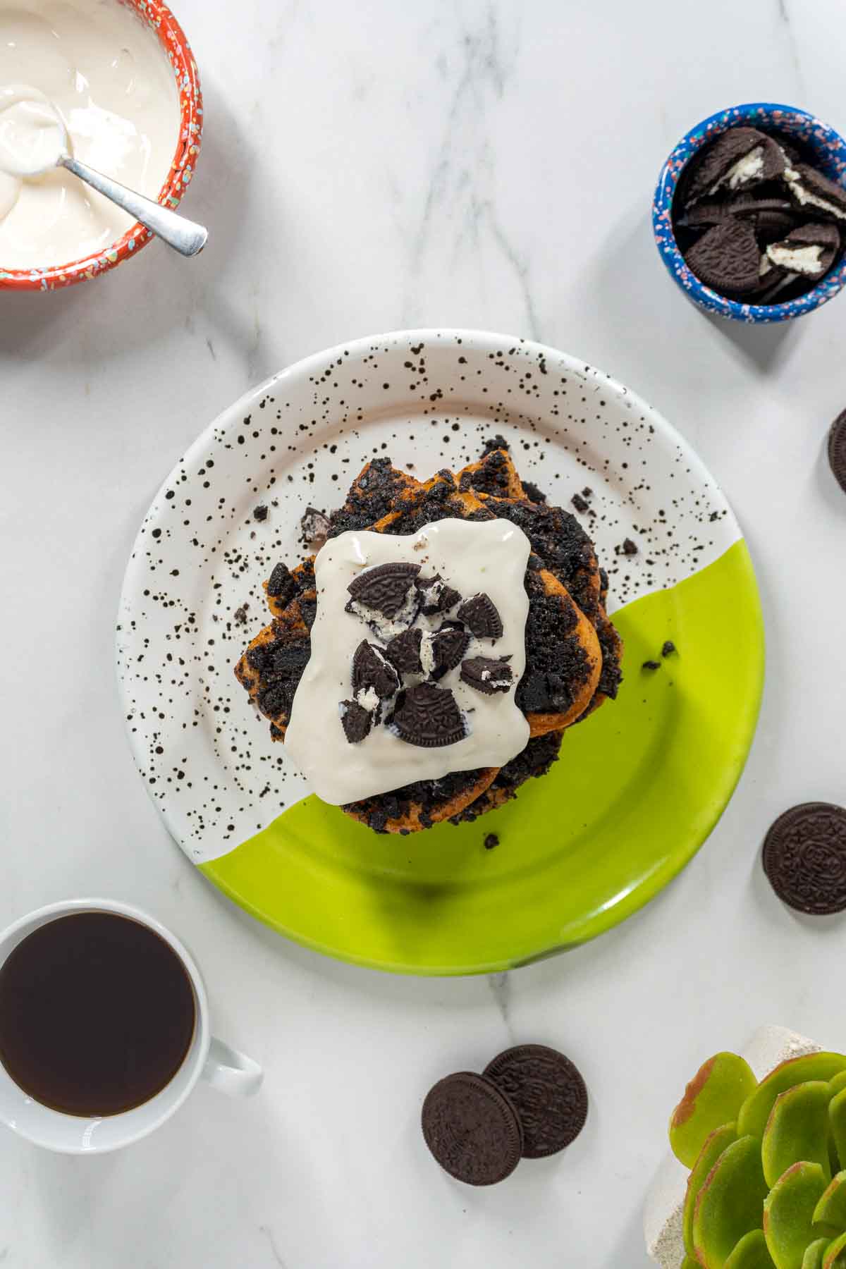 A top down view of Oreo French Toast. The white labneh-based frosting on top is easily seen.