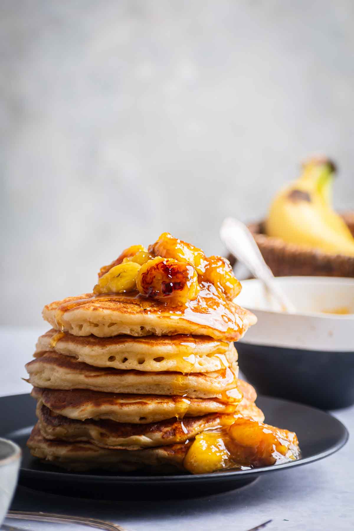 A tall stack of caramelized banana pancakes.