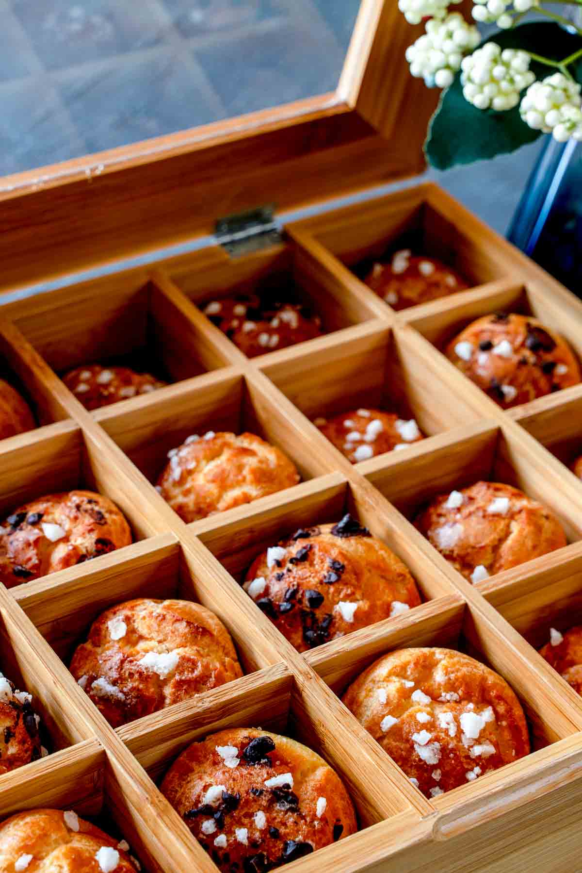 Choux pastry in a compartmentalised wooden box.
