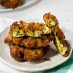 Turkish Mucver fritters made of zucchini on a white dish.