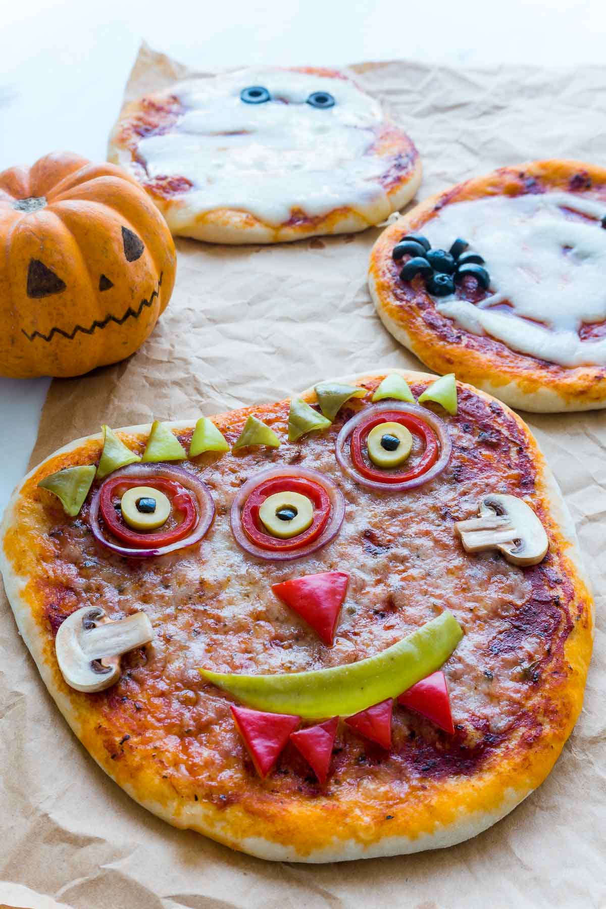 A halloween pizza that looks like Frankenstein's monster.