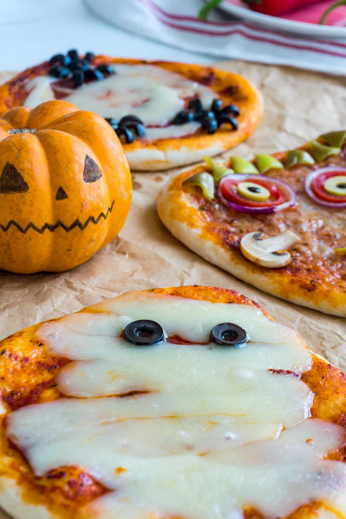 Halloween-themed pizza that looks like a mummy. (The bandages are made of cheese, and the eyes are made of black olive slices.)